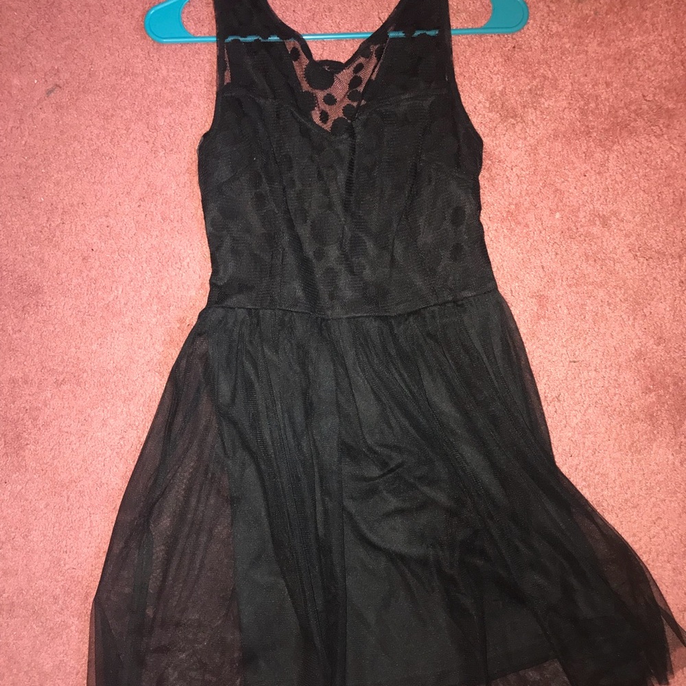 Dealia’s black, polka dotted dress